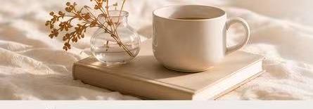 Cup and books on a soft neutral background
